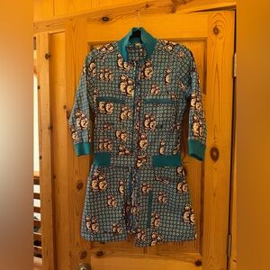 Gsus Romper. Blue and white with Russian Doll pattern.